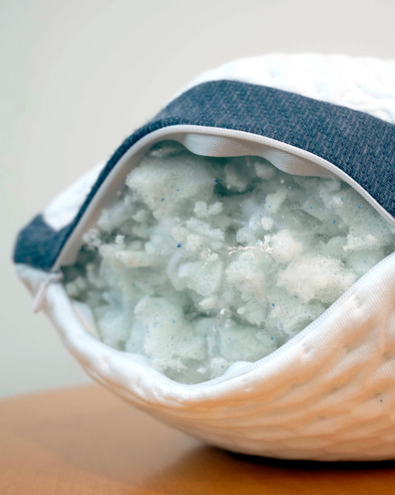 Unzipped A50 Travel Pillow, revealing the clean CertiPUR-US stuffed inside.