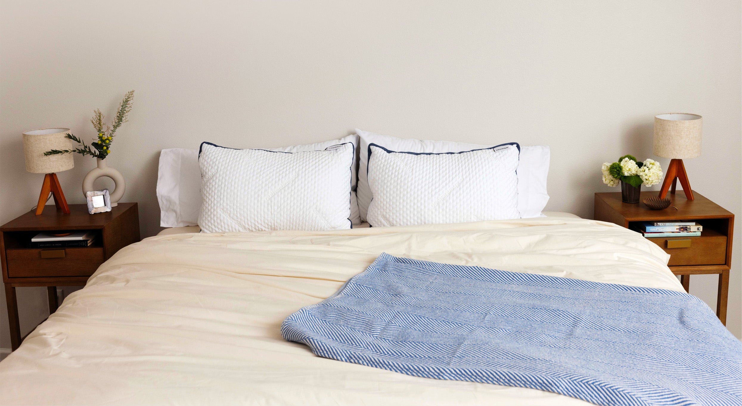 Bed made with Authenticity50 Made in USA products, such as the A50 Duvet Cover, Heritage American Sheets, Custom Comfort Pillow, and Heritage Blanket.