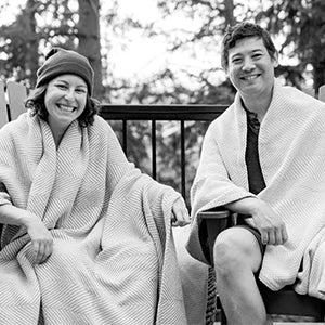 Authenticity50 co-founders Steph & Jimmy bundling up in their heritage blankets.