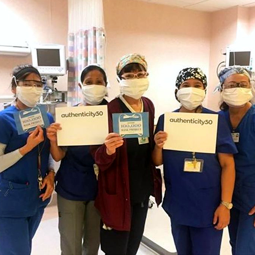 Healthcare workers wearing face masks donated by Authenticity50.