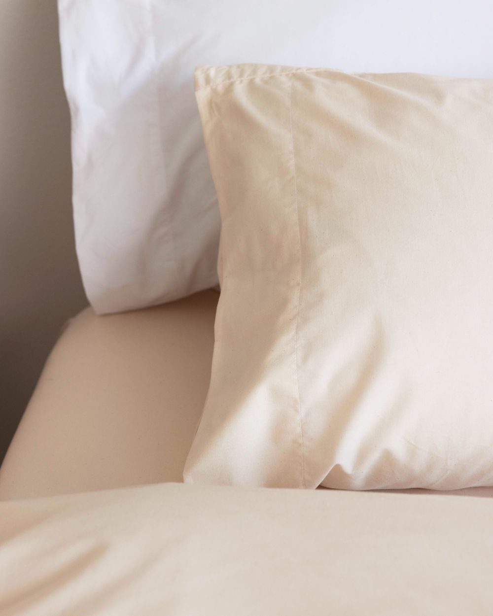 Detail shot of our Made in USA Envelope Closure Pillowcases (in colorways Rustic Cotton - front and Cloud White - back)