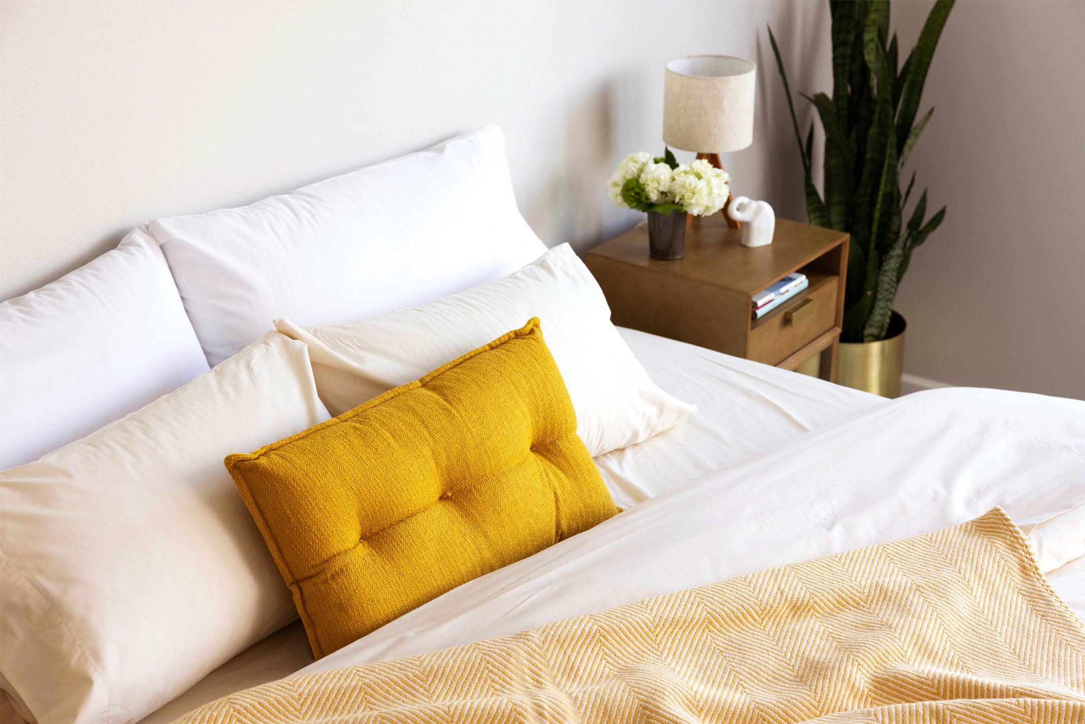 Bed made with Authenticity50's Made in USA bedding collection.