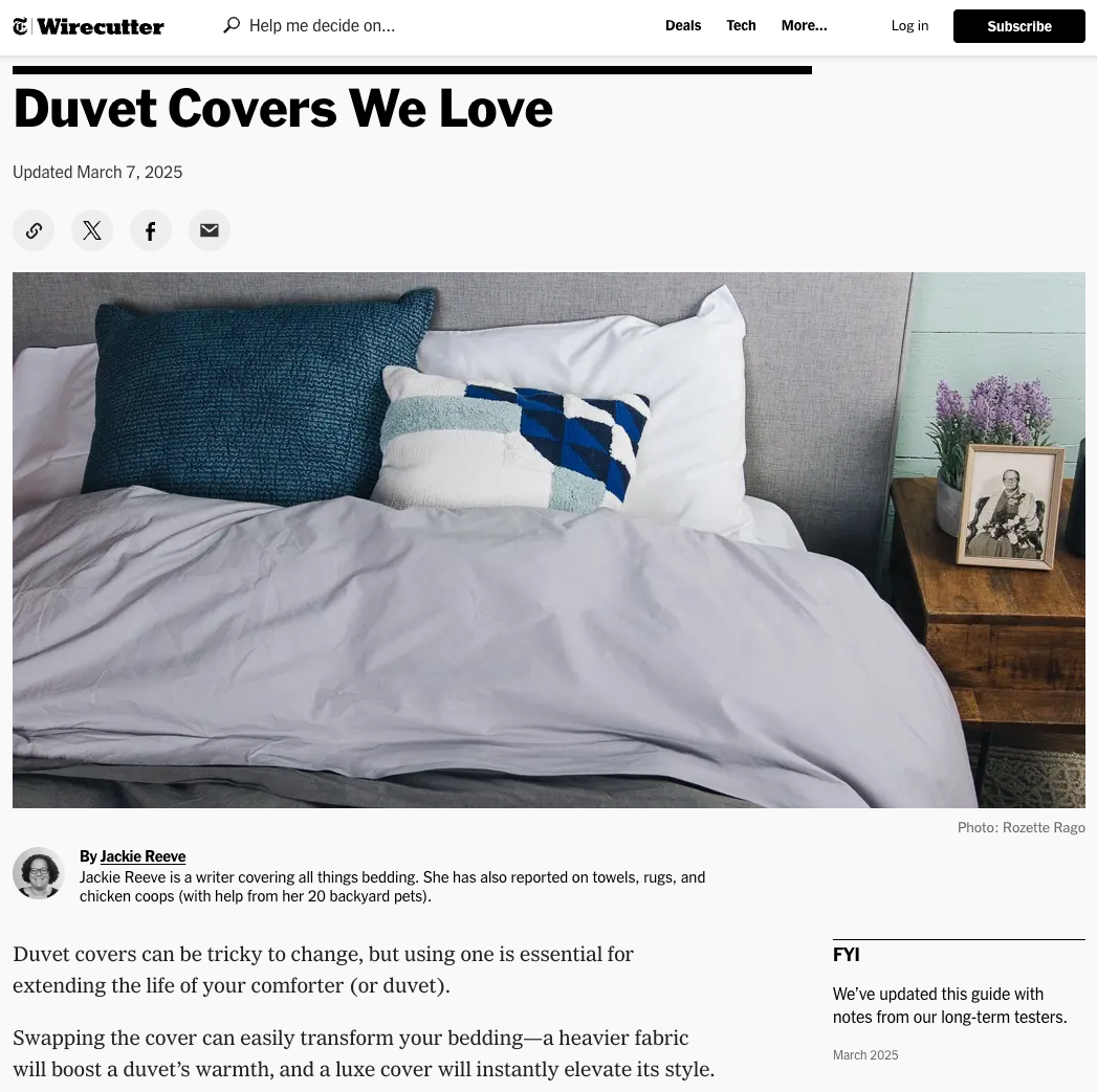 Bed with gray duvet and decorative pillows, featuring Wirecutter's 'Duvet Covers We Love' article.