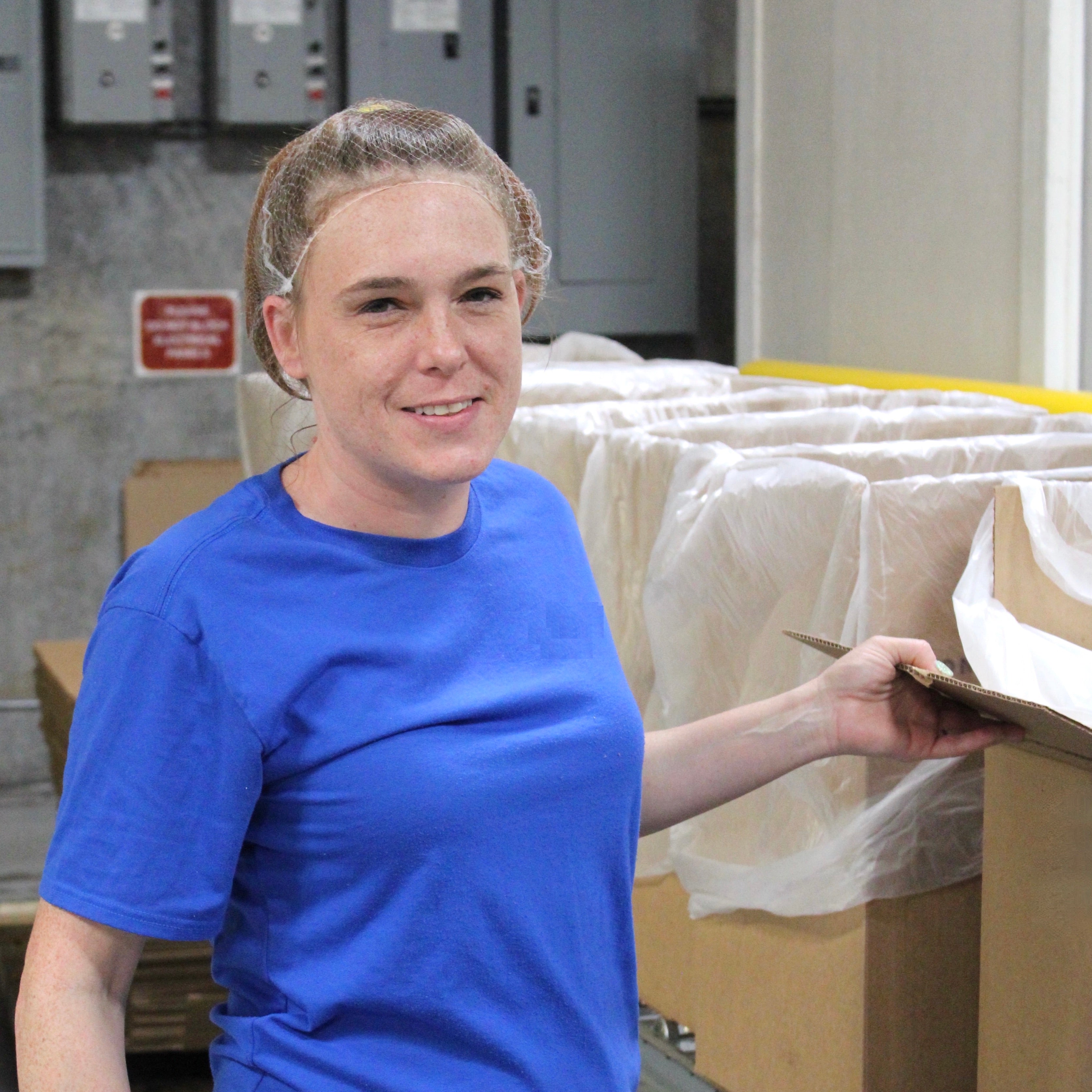 American worker packaging A50 products into boxes. 