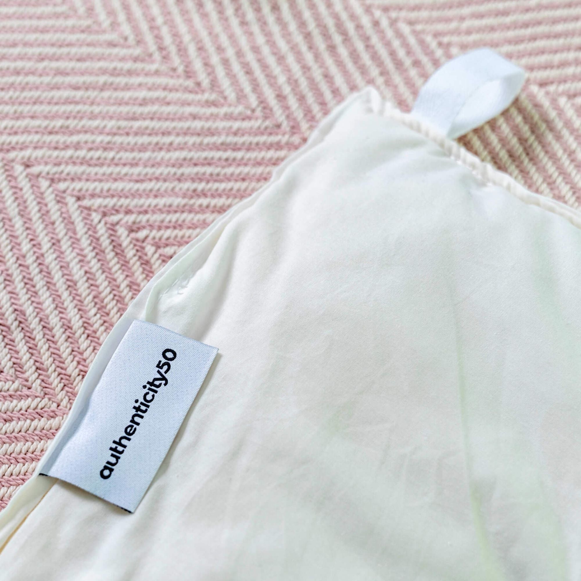 wool duvet insert on top of a cotton blanket