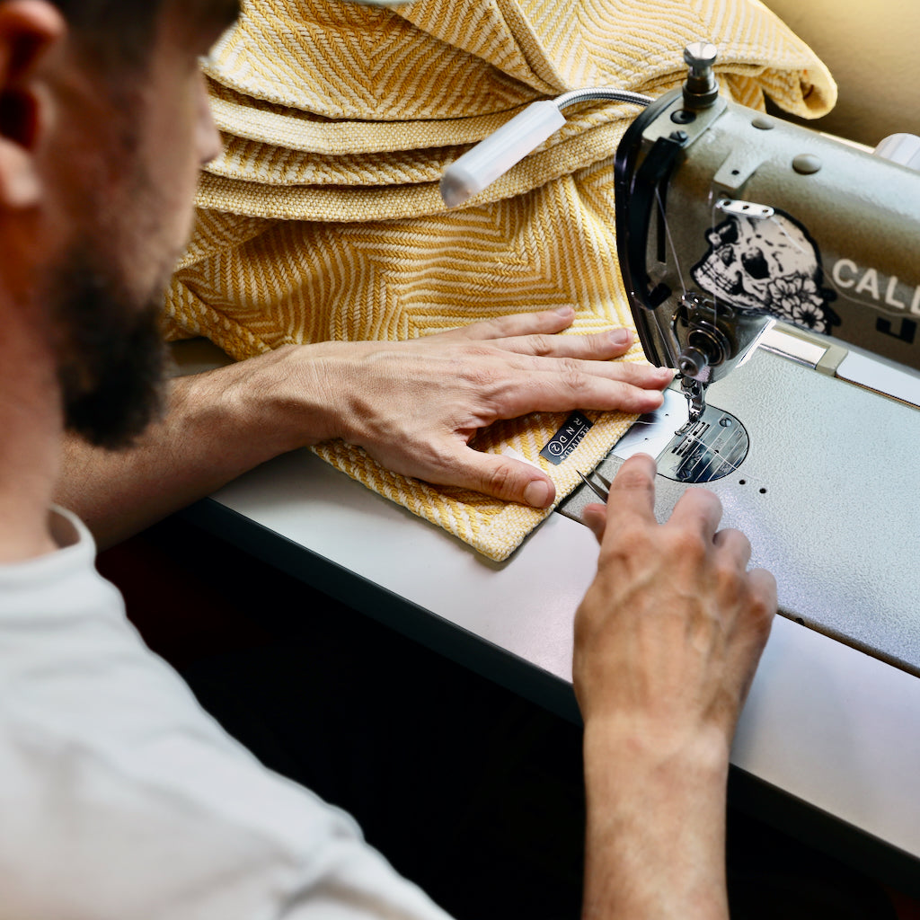 american workers sewing blankets