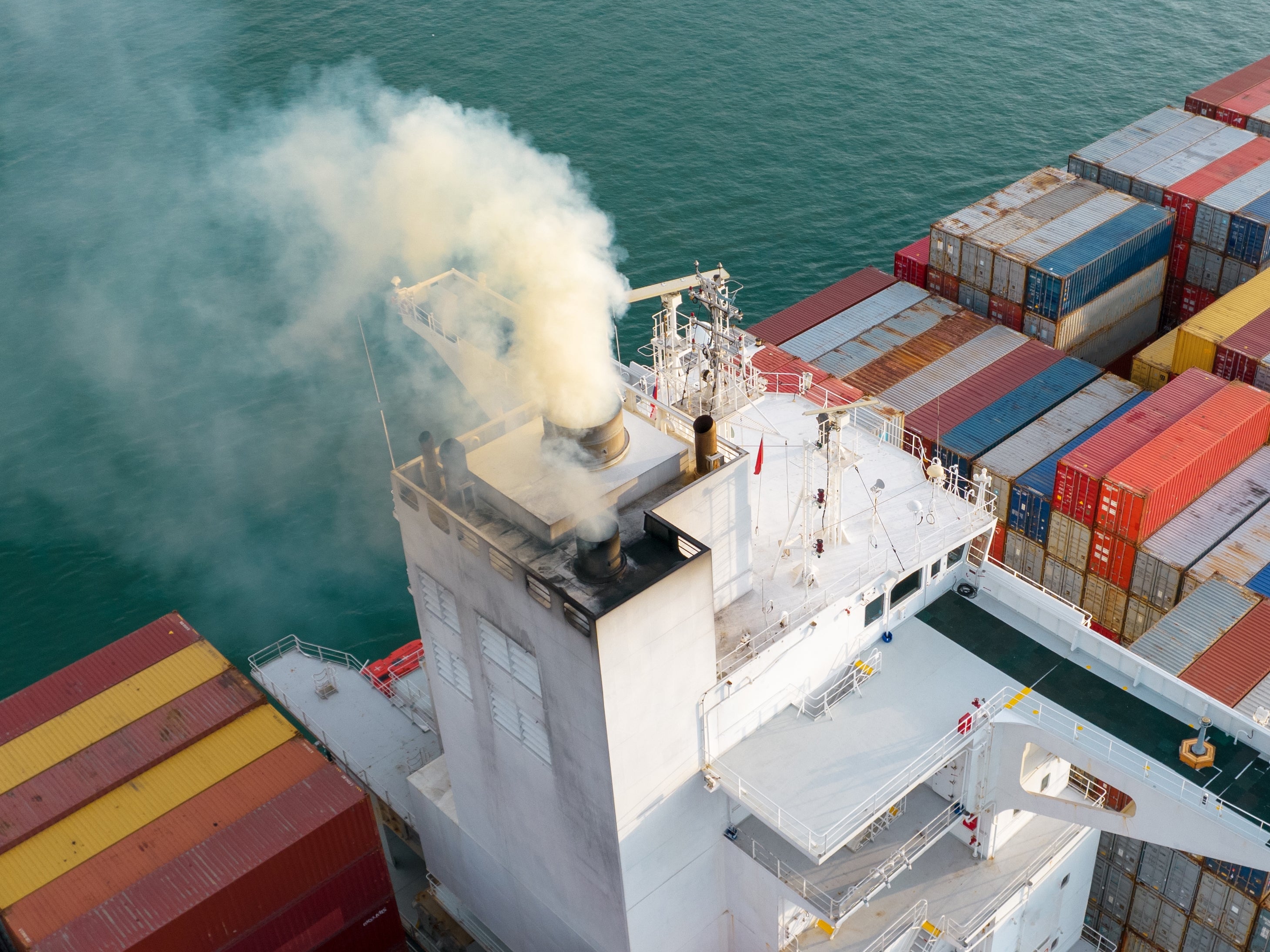 container ship blowing pollution into the air