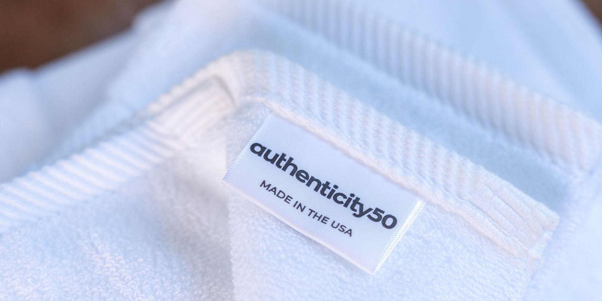 authenticity50 tag on a bath towel