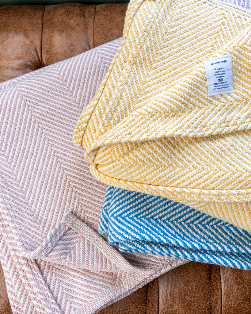 Cotton blankets stacked on top of each other.