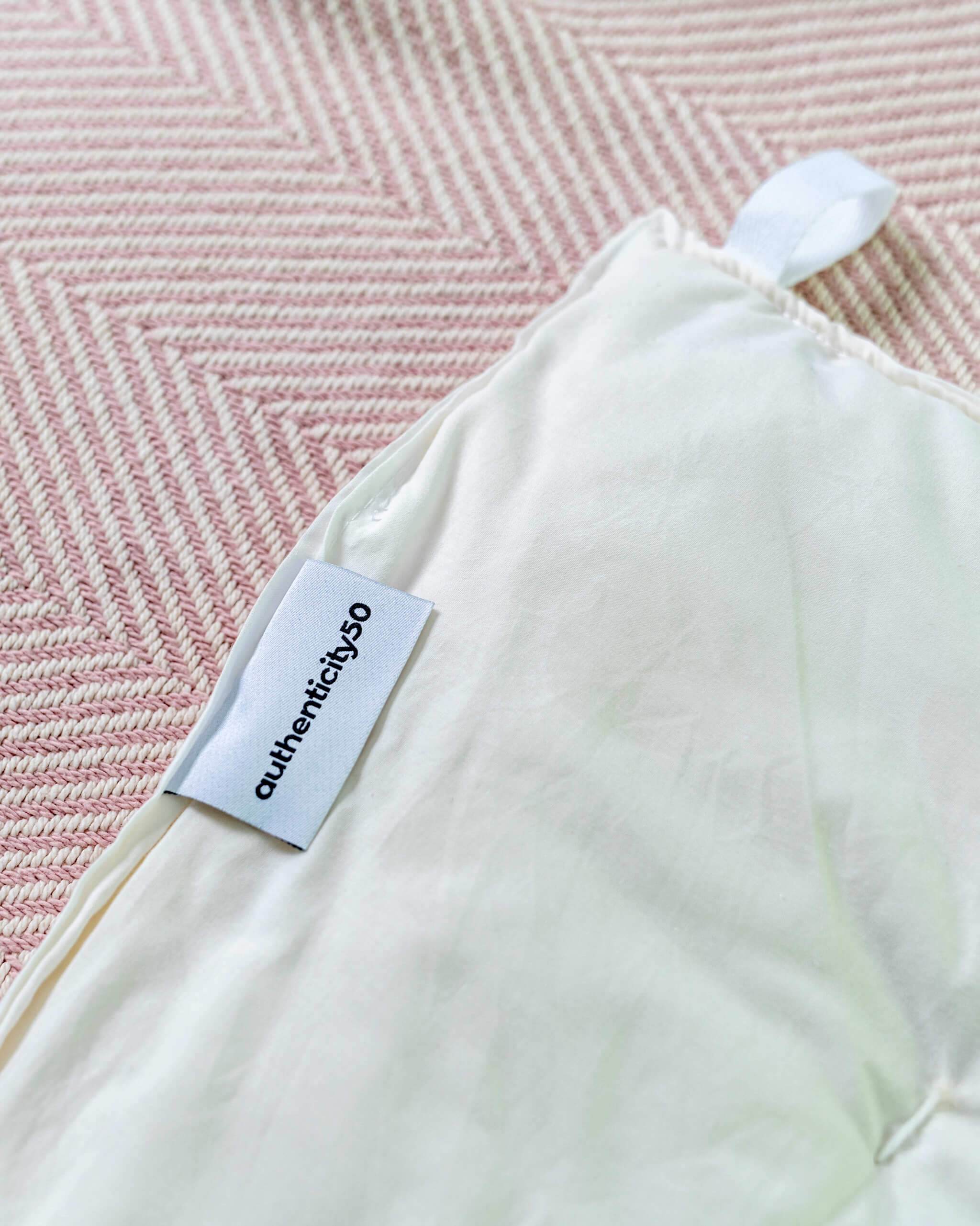 Made in USA wool duvet with Authenticity50 tag and corner loop.