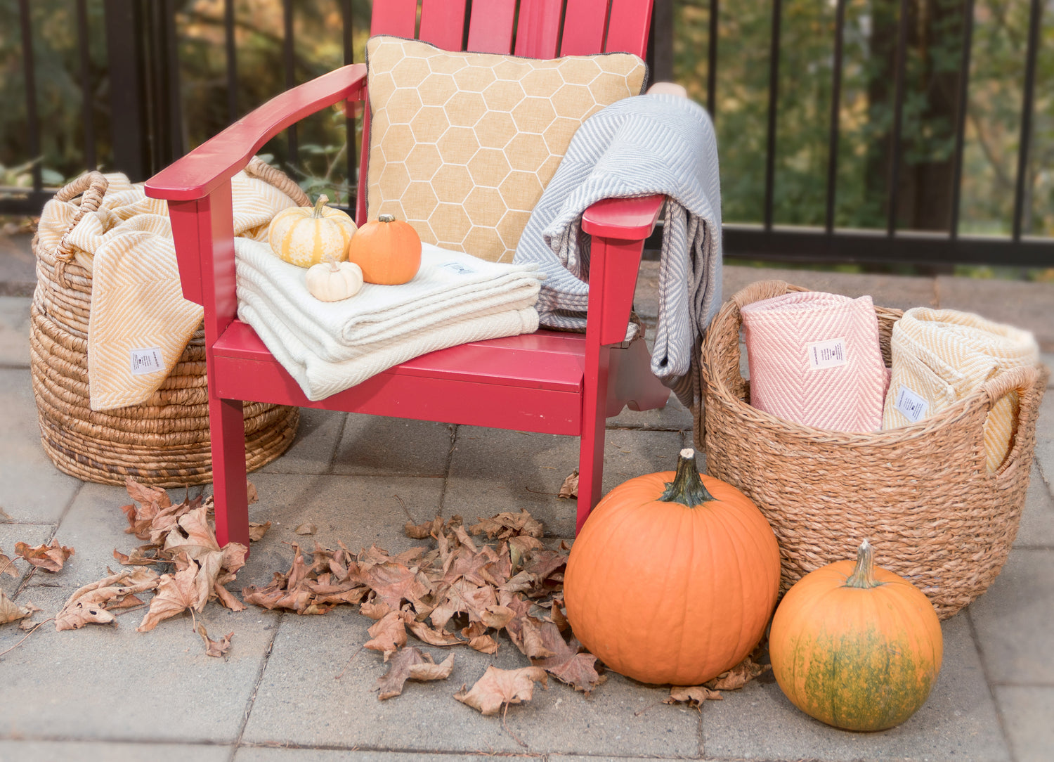 Authenticity50 Heritage Blankets surrounded by fall foliage, pumpkins, and decorations.