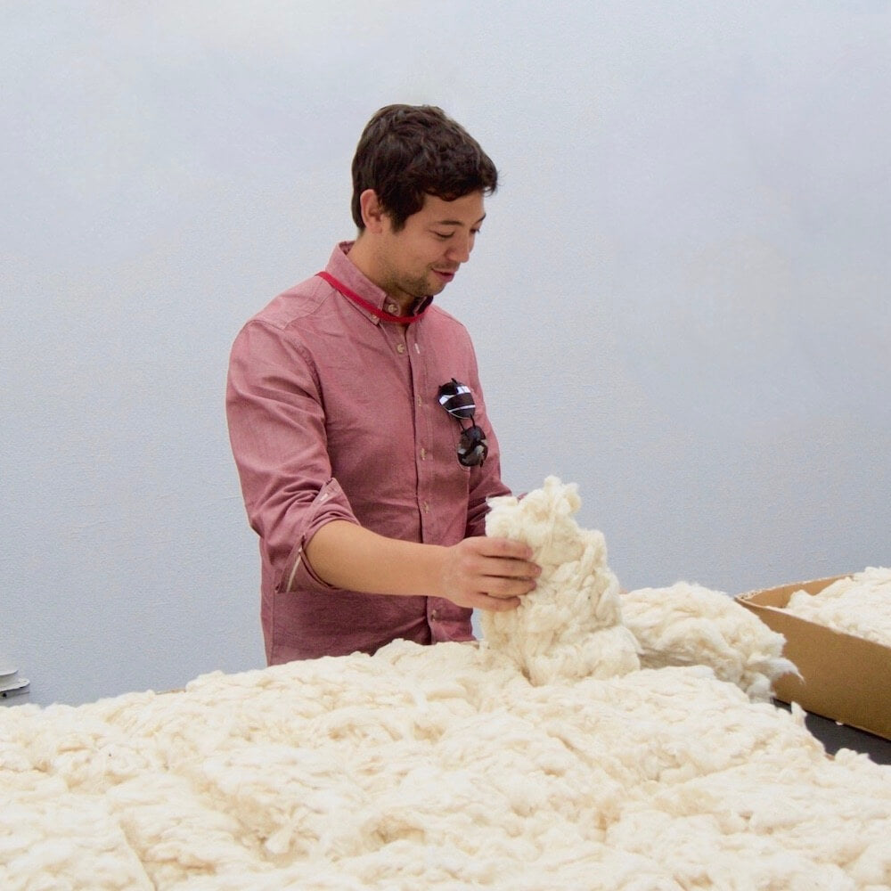 Co-founder, Jimmy, inspecting cotton grown in California
