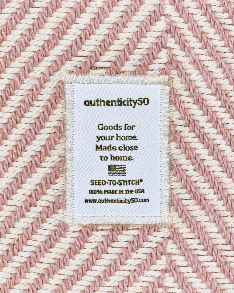 Authenticity50 sew in label on a cotton blanket