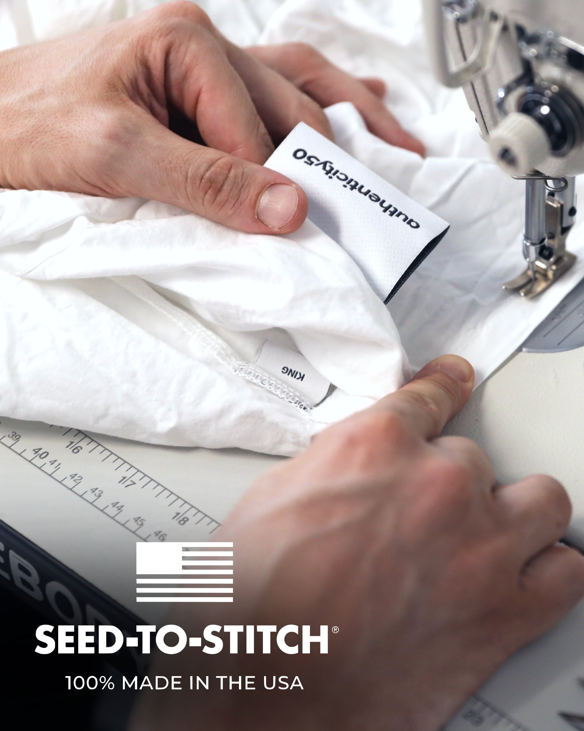 man holding an authenticity50 label while hemming the edges our made in usa duvet cover