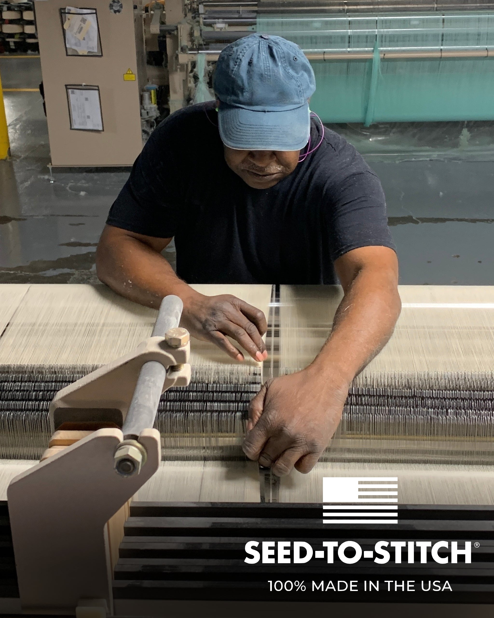 a man fixing the threads on a terry weaving loom that makes authenticty50's luxury made in usa cotton bath towels